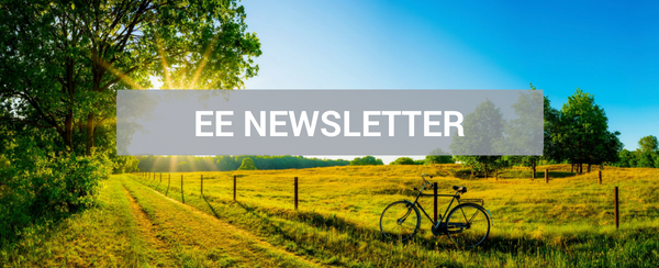 summer field with bicycle and newsletter title